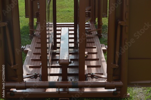 Obraz na plátně Inside view of a rust red cattle chute floor and side panels