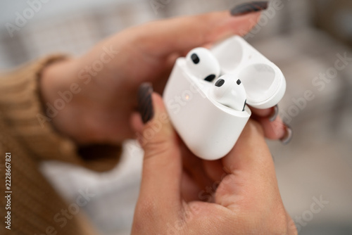 ODESSA, UKRAINE - September 3, 2026 : New Apple AirPods 3 with case in woman hands.