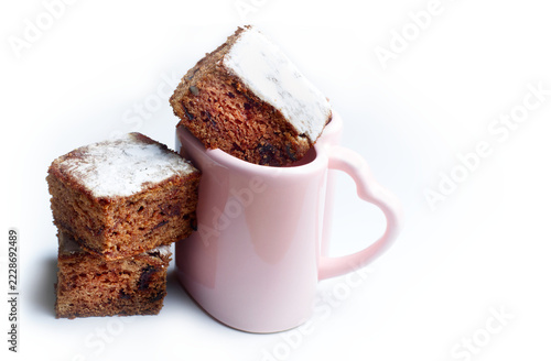 Plum cake squares in heart cup, sweet dessert