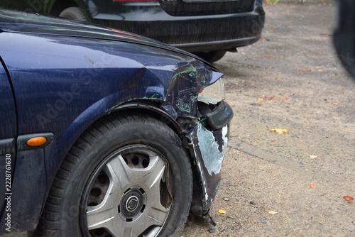 A view of a car damaged in an accident, awaiting repairs
