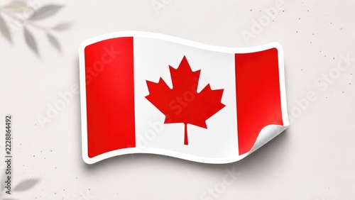 Canadian flag sticker with curled corner showing red maple leaf on white field flanked by red bars