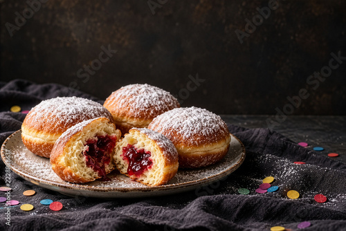 Jam-Filled Berliner Doughnuts with Powdered Sugar and Confetti as Traditional Carnival Food