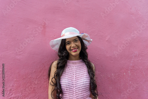 Woman in a Pink Dress and White Hat