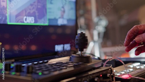 Camera operator using joystick on remote control panel
