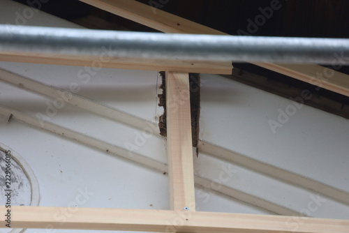 Interior Ceiling Detail Showing New Wooden Battens Meeting Old Rotted Timber with Insulation Material