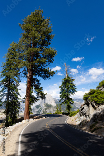 Winding Glacier Point Road with scenic view of Half Dome in Yosemite National Park California