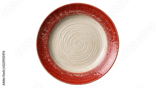 Fotografie Rustic red speckled ceramic dinner plate with concentric circle texture, isolate