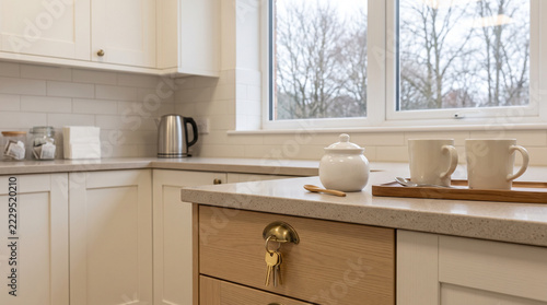 Brass keyring hanging on kitchen drawer