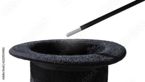 Obraz na plátně Black felt top hat with magic wand hovering above, isolated on transparent backg