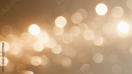 Photorealistic golden lights bokeh background with soft glowing white and pale gold circles