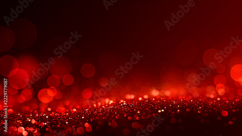 Deep wine red bokeh background with glittering lights and uncluttered copy space