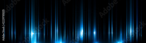 Vertical beams of blue light create a sleek futuristic visual effect. The thin radiant lines vary in intensity and spacing across a dark background. This abstract illumination suits.