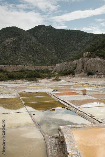 Obraz na plátně Ancient salt evaporation ponds in a desert valley