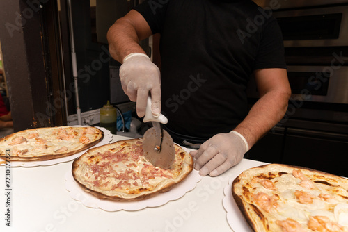 Preparing and slicing the tarte flambée on the bridge in 