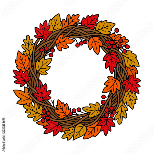 Decorative autumn wreath with colorful fall leaves and red berries