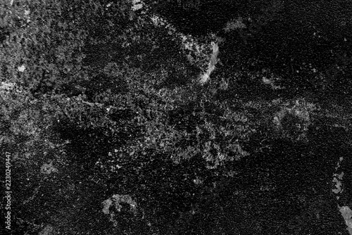 Sandpaper texture background. A worn, black, grainy, crumpled surface with cracks. Gray grunge background.