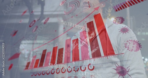 Standing scientist in lab coat studying transparent display at research lab, with red bar charts