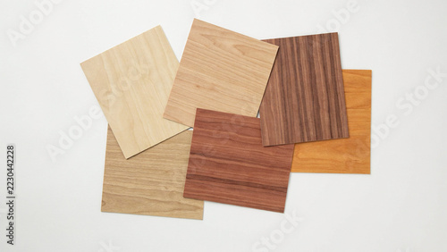 Assortment of wood veneer samples on white background