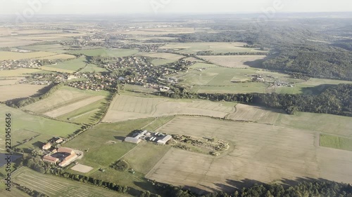 Aerial view of farmland agricultural fields and village in countryside