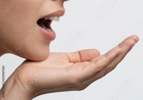 Woman speaking passionately with open mouth and hand gesture in presentation setting