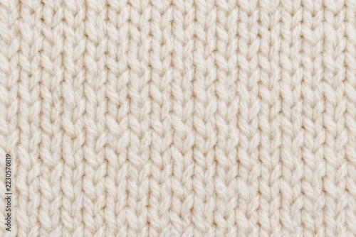Soft white wool knitting with natural yarn texture