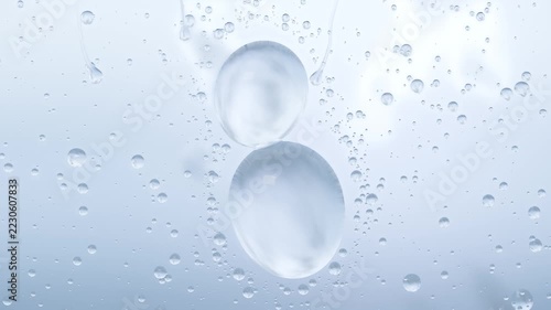 Merging top-right beads forming runner while two large drops sliding on glass by gravity cloudy sky