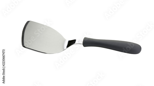 Obraz na plátně Isolated metal spatula with black handle, shiny kitchen utensil for cooking and serving food