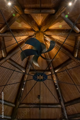 Elegant rustic ceiling fan set against wooden beams at Killarney Mountain Lodge, Ontario, showcasing architecture's blend with nature.