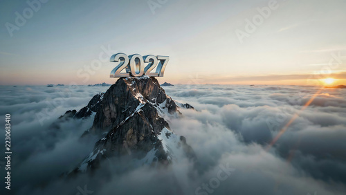 Year 2027 numbers on a majestic mountain peak above a sea of clouds at sunrise, symbolizing future goals and success.