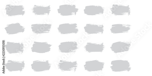 A set of light gray brush strokes arranged in a grid pattern on a clean background, showcasing a minimalist and artistic aesthetic.