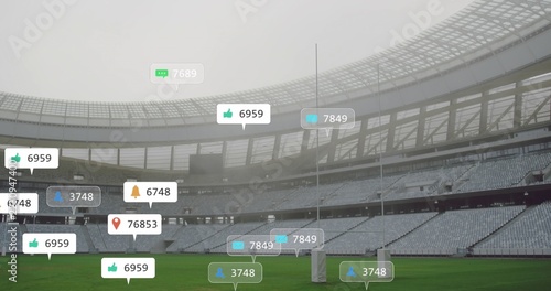 Showing central goal post, grass pitch in stadium, with tiered seats, curved roof