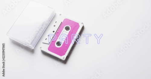 Displaying pink labeled cassette and open clear case on white table PARTY overlay, copy space