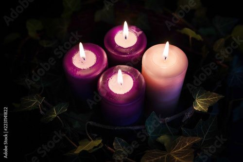 Advent wreath with four purple candles, traditional Christmas preparation.