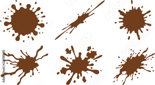 Brown ink splatters and liquid paint splashes isolated on a white background