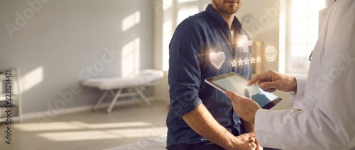 Doctor Using Tablet for Patient Care in Bright and Modern Medical Office Environment