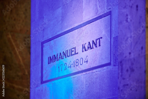 Obraz na plátně Illuminated stone plaque of Immanuel Kant grave with dates in soft purple lighti