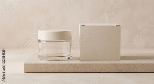 Cosmetic Cream Jar and Box: A minimalist aesthetic showcases a clean glass jar for cosmetic cream and a simple cardboard box, suggesting skincare or beauty products.