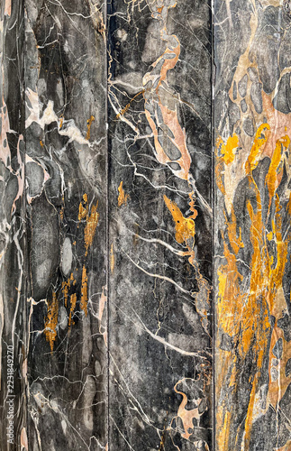Obraz na plátně Close-up texture background of dark marble slab with expressive orange and white