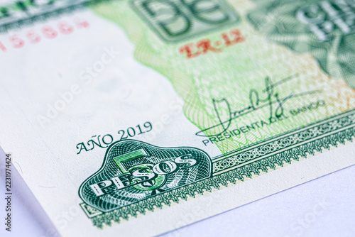 Close-up of a green Cuban 5 pesos banknote featuring . Detailed macro shot of Cuba currency paper money bill, 2019 series.