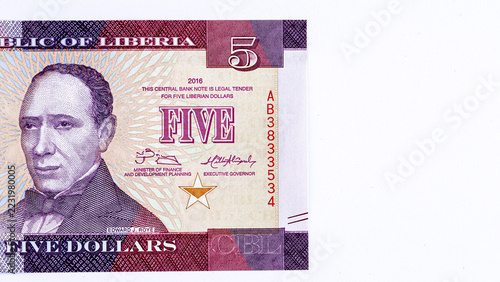 Close-up of a 5 Liberian dollars banknote featuring a portrait of Presiden. Detailed macro shot of Liberia currency paper money bill.