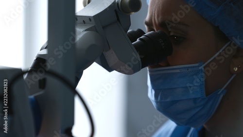 Obraz na plátně Tight crop of female surgeon with eye at 12
