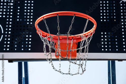 Basketball hoop with an iron chain.