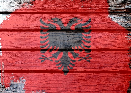 Obraz na plátně Albania flag - realistic looking flag on a wooden surface
