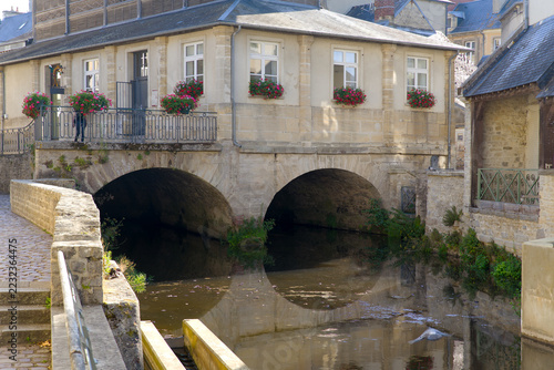 Idyllic scenery at French city of Bayeux with Aure River and historic buildings on a sunny summer afternoon. Photo taken July 17th, 2026, Bayeux, Normandie, France.