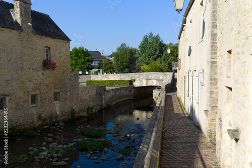 Idyllic scenery at French city of Bayeux with Aure River and historic buildings on a sunny summer afternoon. Photo taken July 17th, 2026, Bayeux, Normandie, France.