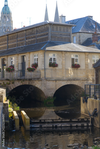 Idyllic scenery at French city of Bayeux with Aure River and historic buildings on a sunny summer afternoon. Photo taken July 17th, 2026, Bayeux, Normandie, France.