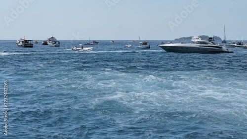 Luxury yachts, speedboats and water churn in blue Tyrrhenian Sea along Amalfi Coast, Italy. Summer Mediterranean cruise, yachting lifestyle, luxury vacation, travel destination and marine concept