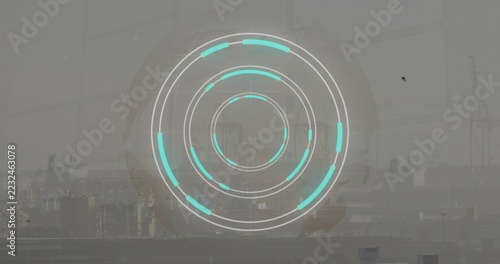 Projecting circular AR HUD showing concentric rings, cyan segments and faint grid over hazy port