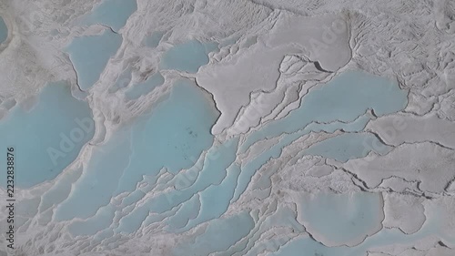 Aerial view of breathtaking natural site of white travertine thermal terraces, Pamukkale, Türkiye	
