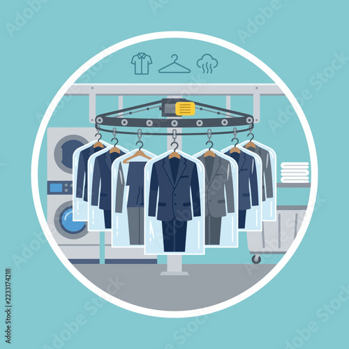 Circular wardrobe with hanging suits and shirts in laundry room